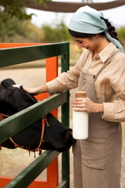 side-view-smiley-woman-petting-cow_23-2149514582.jpg